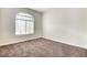 Bedroom displays neutral carpet and a window, providing a quiet retreat at 8725 Red Rio Dr # 203, Las Vegas, NV 89128