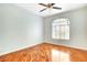 Bright bedroom features hardwood floors, window, and neutral wall paint at 8725 Red Rio Dr # 203, Las Vegas, NV 89128