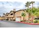 Inviting multi-level home showcasing beautiful desert landscaping and an attached two-car garage at 8725 Red Rio Dr # 203, Las Vegas, NV 89128