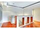 Bright interior featuring elegant hardwood floors and a decorative banister with wood accents at 8725 Red Rio Dr # 203, Las Vegas, NV 89128