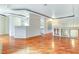 Spacious room with hardwood floors, decorative banister, and smooth transition to kitchen area at 8725 Red Rio Dr # 203, Las Vegas, NV 89128