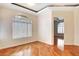 Bright living room featuring hardwood floors, window, and an open doorway at 8725 Red Rio Dr # 203, Las Vegas, NV 89128