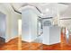 Open living area showcases hardwood floors and a view of the bright kitchen at 8725 Red Rio Dr # 203, Las Vegas, NV 89128