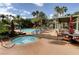 Resort-style pool area with a hot tub, comfortable seating, and beautifully landscaped surroundings at 8725 Red Rio Dr # 203, Las Vegas, NV 89128