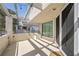 Private balcony with shaded pergola cover, string lights, neutral tones, and sliding glass door access at 8932 Antioch Way, Las Vegas, NV 89117