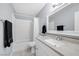 Updated bathroom features a shower-tub combo with granite countertop vanity at 8932 Antioch Way, Las Vegas, NV 89117