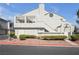 Charming stucco condo with a private balcony, red rock landscaping, and a lovely front yard at 8932 Antioch Way, Las Vegas, NV 89117
