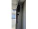 Garage door opener installed in a residential garage with partially open garage door at 8932 Antioch Way, Las Vegas, NV 89117