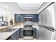 The open kitchen features stainless steel appliances and plenty of cabinet space at 8932 Antioch Way, Las Vegas, NV 89117