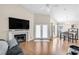 Open floor plan with living room, fireplace, dining area, and French door to balcony at 8932 Antioch Way, Las Vegas, NV 89117