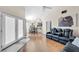 Inviting living area with vaulted ceilings, hardwood floors, and a comfortable seating arrangement at 8932 Antioch Way, Las Vegas, NV 89117