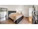 The main bedroom features a dark wood bed frame and lots of space at 8932 Antioch Way, Las Vegas, NV 89117
