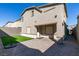 This spacious backyard features a brick patio and small patch of artificial grass at 9239 Albus Hills Ave, Las Vegas, NV 89143