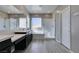 Bright bathroom featuring double vanity, shower, and bathtub with wood look tile floors at 9239 Albus Hills Ave, Las Vegas, NV 89143