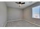 Bright bedroom with neutral colors, carpet, and ceiling fan at 9239 Albus Hills Ave, Las Vegas, NV 89143