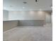 Second view of the open bonus room with neutral walls, carpet, and stairway access at 9239 Albus Hills Ave, Las Vegas, NV 89143