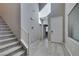 Inviting entryway with stairs, high ceilings, tile flooring, and access to the rest of the home at 9239 Albus Hills Ave, Las Vegas, NV 89143