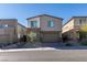 Beautiful two-story home with stone accents, a two-car garage, and a landscaped front yard at 9239 Albus Hills Ave, Las Vegas, NV 89143