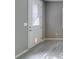Welcoming entryway and living space with a modern door featuring decorative glass accents at 9239 Albus Hills Ave, Las Vegas, NV 89143