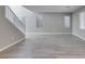 Large living room with tile floors, neutral gray walls, stairs to the left, and plenty of natural light at 9239 Albus Hills Ave, Las Vegas, NV 89143