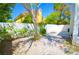 Bright backyard featuring a white brick fence providing privacy and a gravel yard at 9408 Amber Valley Ln, Las Vegas, NV 89134