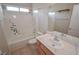Bathroom features include tile flooring, marble countertops, a tub and shower combination at 9408 Amber Valley Ln, Las Vegas, NV 89134