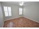 Bedroom boasts hardwood flooring, neutral walls, and plantation shutters for abundant natural light at 9408 Amber Valley Ln, Las Vegas, NV 89134