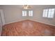 Bedroom boasts hardwood flooring, neutral walls, and plantation shutters for abundant natural light at 9408 Amber Valley Ln, Las Vegas, NV 89134