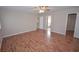 Spacious bedroom features wood floors, neutral walls, ceiling fan, and natural light at 9408 Amber Valley Ln, Las Vegas, NV 89134