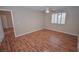 Bedroom featuring hardwood floors, a ceiling fan, and natural light at 9408 Amber Valley Ln, Las Vegas, NV 89134