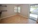 Bright dining area with hardwood floors, a window, and a sliding door to the patio at 9408 Amber Valley Ln, Las Vegas, NV 89134
