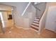 Bright entryway with stairs leading to the second floor and hardwood floors at 9408 Amber Valley Ln, Las Vegas, NV 89134