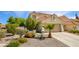 Inviting single-Gathering home featuring desert landscaping, a two-car garage and a traditional roof at 9408 Amber Valley Ln, Las Vegas, NV 89134