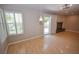 Spacious living room featuring hardwood floors, fireplace and sliding door to backyard at 9408 Amber Valley Ln, Las Vegas, NV 89134