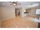 Open-concept living and dining area featuring hardwood floors and a ceiling fan at 9408 Amber Valley Ln, Las Vegas, NV 89134