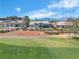A high aerial view of homes on the golf course, in a maturely landscaped community at 9513 Villa Ridge Dr, Las Vegas, NV 89134
