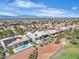 High aerial view showing manicured landscaping, golf course and a desert landscape at 9513 Villa Ridge Dr, Las Vegas, NV 89134
