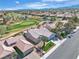 Aerial view of the home, golf course and surrounding community at 9513 Villa Ridge Dr, Las Vegas, NV 89134
