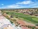 A high aerial view of a community showing golf course and desert landscaping at 9513 Villa Ridge Dr, Las Vegas, NV 89134