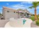 Well-kept backyard features a spa, tile roof, stucco walls, and a covered patio at 9513 Villa Ridge Dr, Las Vegas, NV 89134
