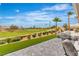Expansive backyard with golf course views, manicured landscaping, and stylish patio furniture at 9513 Villa Ridge Dr, Las Vegas, NV 89134