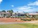 Backyard view of home with desert landscaping and a golf course in the background at 9513 Villa Ridge Dr, Las Vegas, NV 89134
