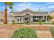 Stunning backyard with lush lawn, spa, and outdoor kitchen at 9513 Villa Ridge Dr, Las Vegas, NV 89134