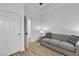 Bright bedroom featuring a sofa and a closet with a white door at 9513 Villa Ridge Dr, Las Vegas, NV 89134