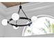 Modern chandelier with globe lights, perfect for a dining room, sitting room, or bedroom at 9513 Villa Ridge Dr, Las Vegas, NV 89134