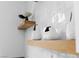 Decorative vases displayed on floating shelves accent a bright kitchen at 9513 Villa Ridge Dr, Las Vegas, NV 89134