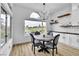 Cozy dining area with golf course views from arched windows and modern decor at 9513 Villa Ridge Dr, Las Vegas, NV 89134