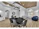 Elegant dining room showcases modern chandelier, stylish seating, and wood-look flooring at 9513 Villa Ridge Dr, Las Vegas, NV 89134