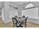 Charming dining area with stylish seating, a modern chandelier, and large windows offering plenty of light at 9513 Villa Ridge Dr, Las Vegas, NV 89134