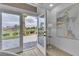 The open door reveals views of the surrounding golf course at 9513 Villa Ridge Dr, Las Vegas, NV 89134